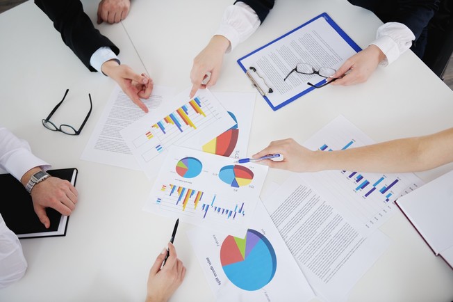 Desktop analysis hands graph chart