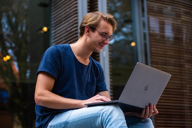 Desktop selective focus photo of man using laptop 1438081