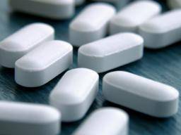Desktop white pills on a table 1